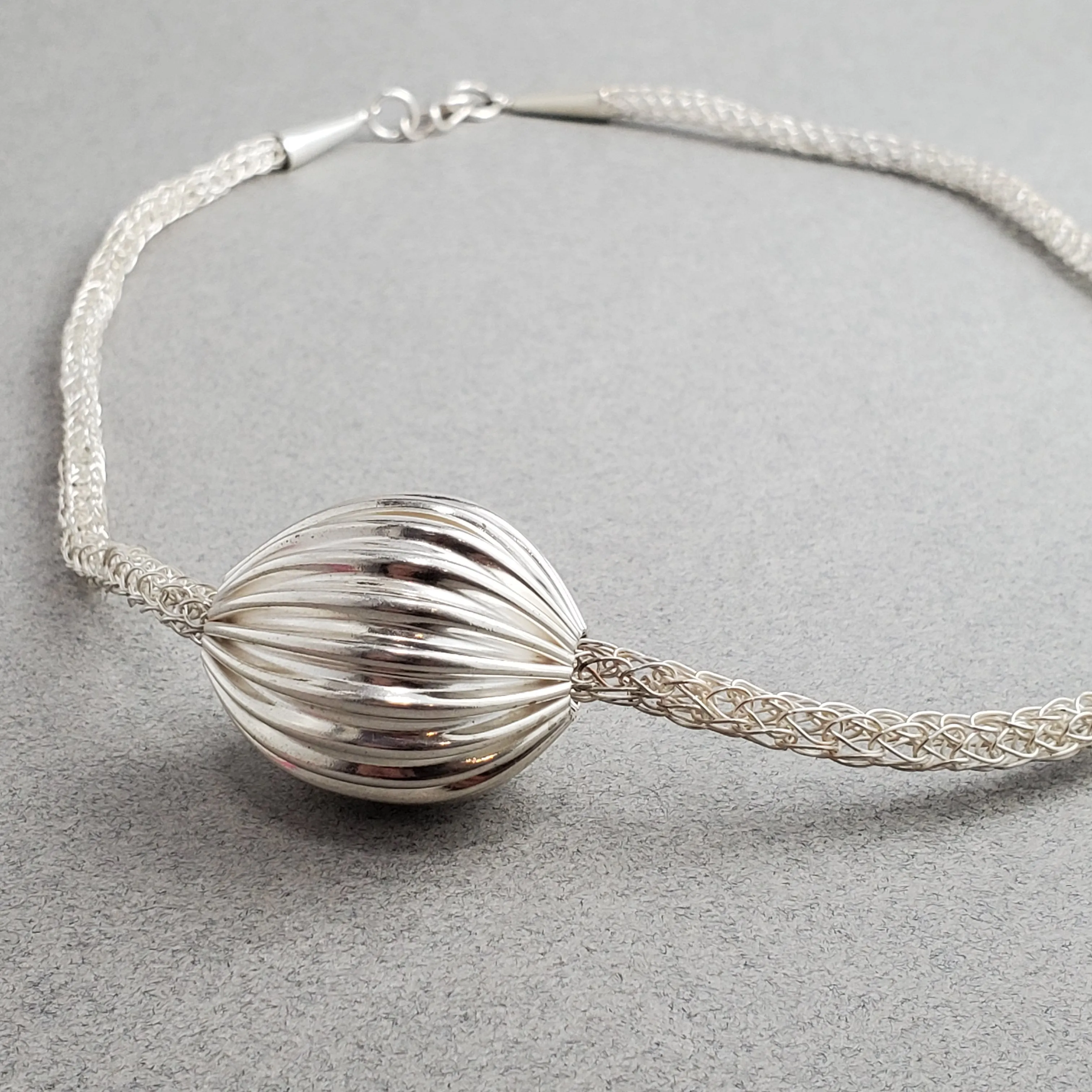 Asymmetrical Pleated Hollow Silver Bead on Handmade Woven Necklace, Fold Formed Silver Necklace, Viking Knit Chain and Fine Silver Ball