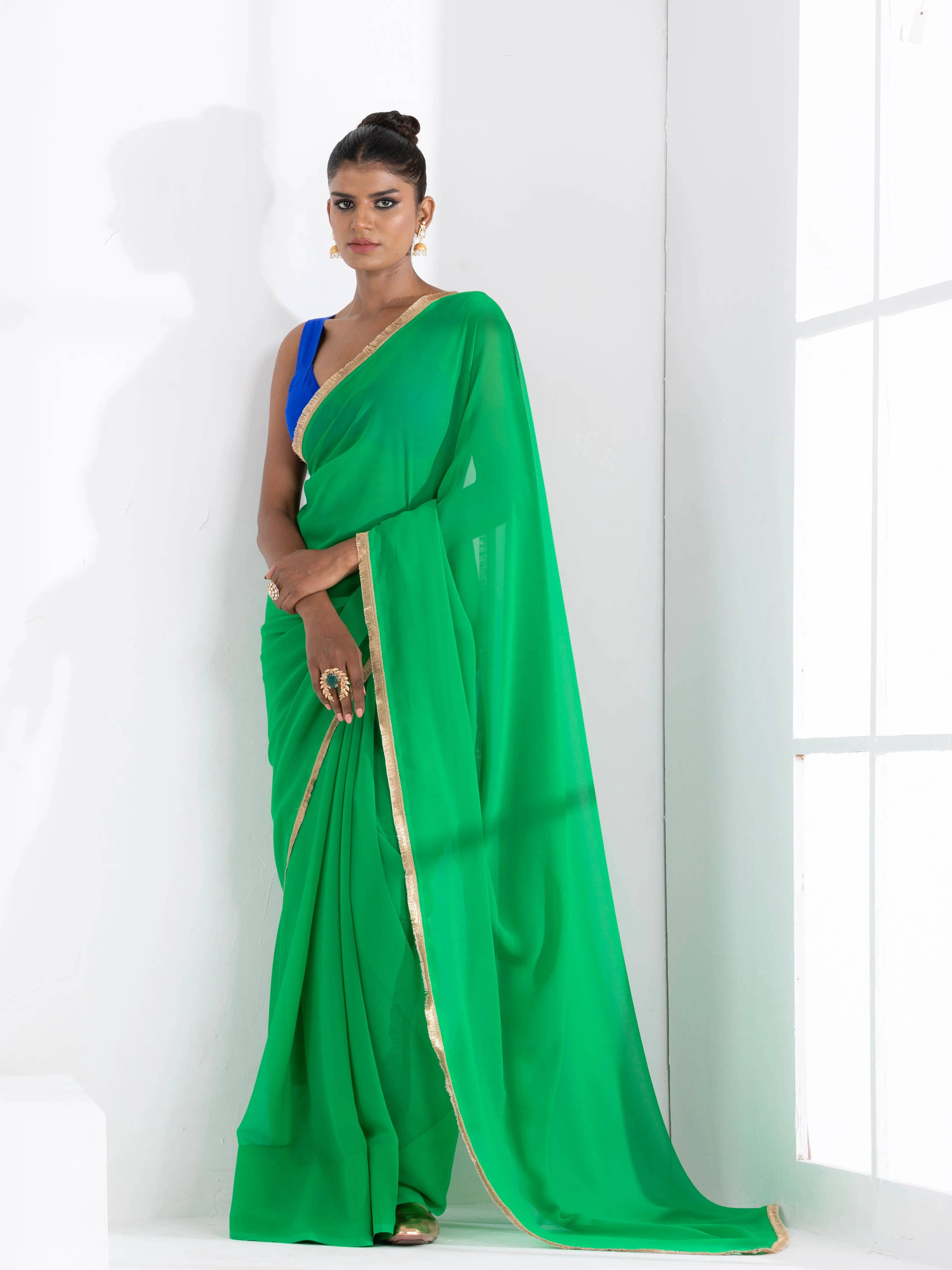 Irish Green Georgette Saree with Lace and Blue Posh Blouse Fabric