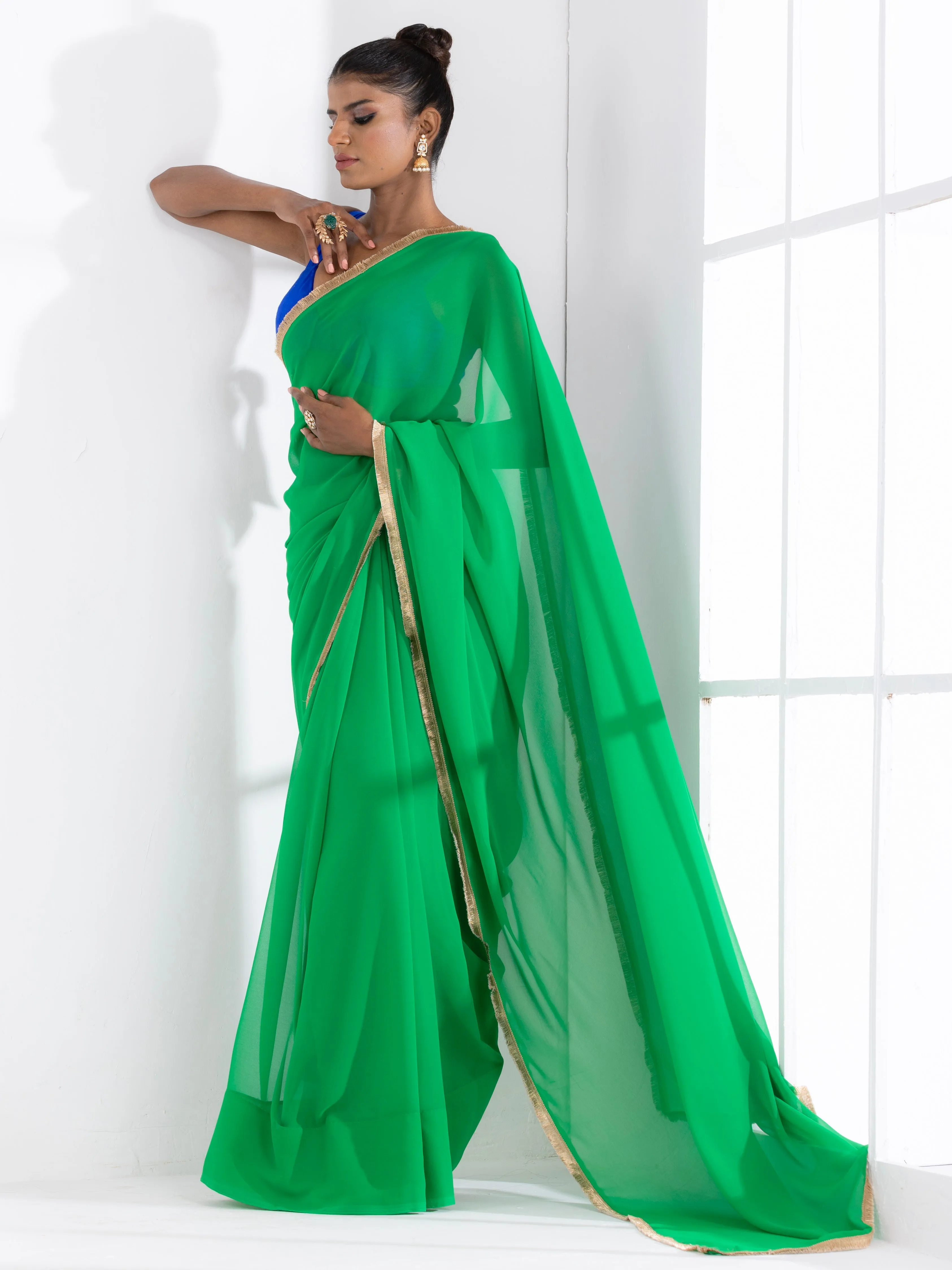 Irish Green Georgette Saree with Lace and Blue Posh Blouse Fabric