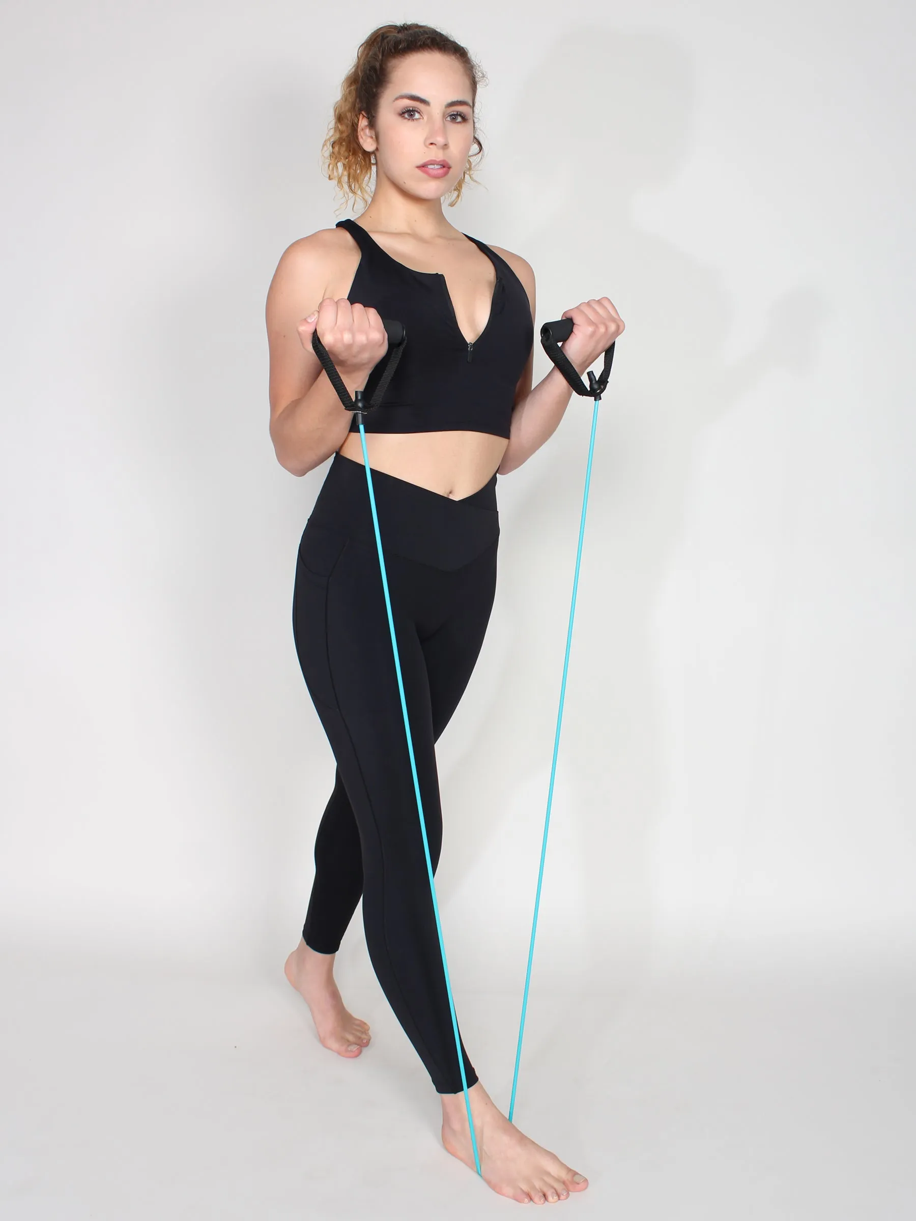 Seamless look half zip sports bra - black