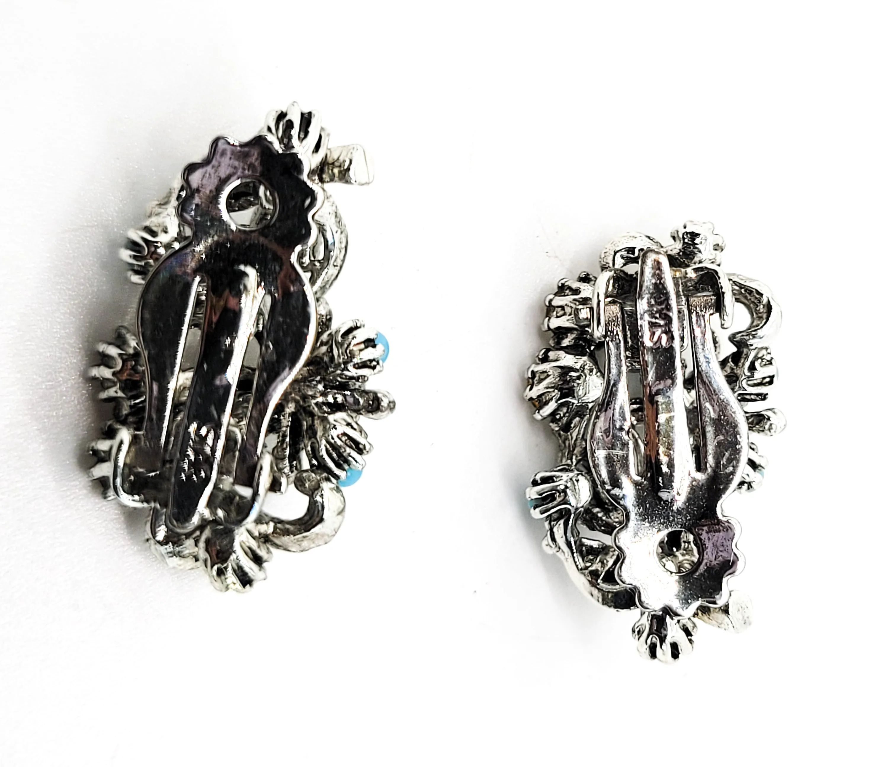 Star signed baby blue silver toned vintage flower earrings with faux pearl accents.