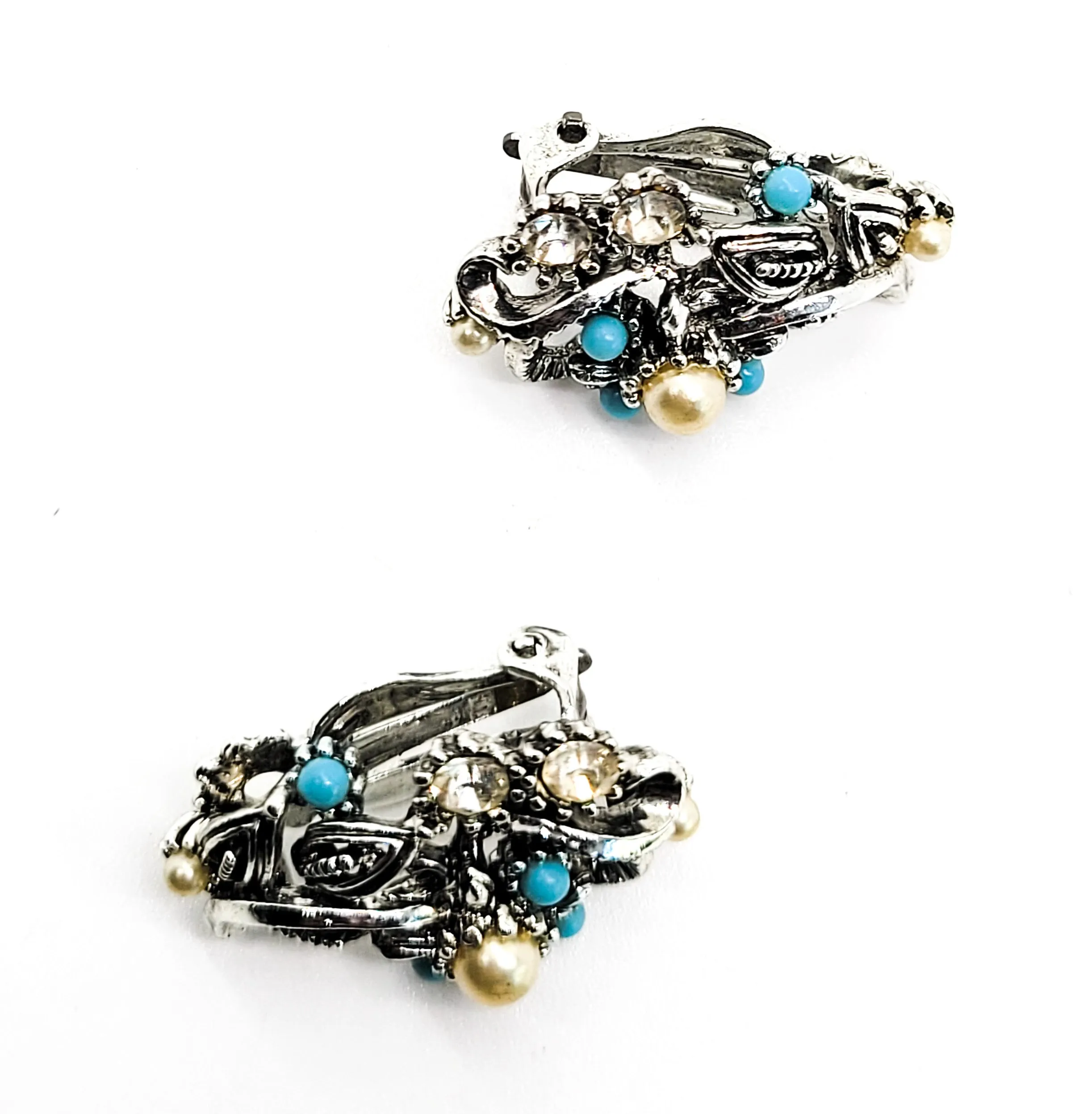 Star signed baby blue silver toned vintage flower earrings with faux pearl accents.