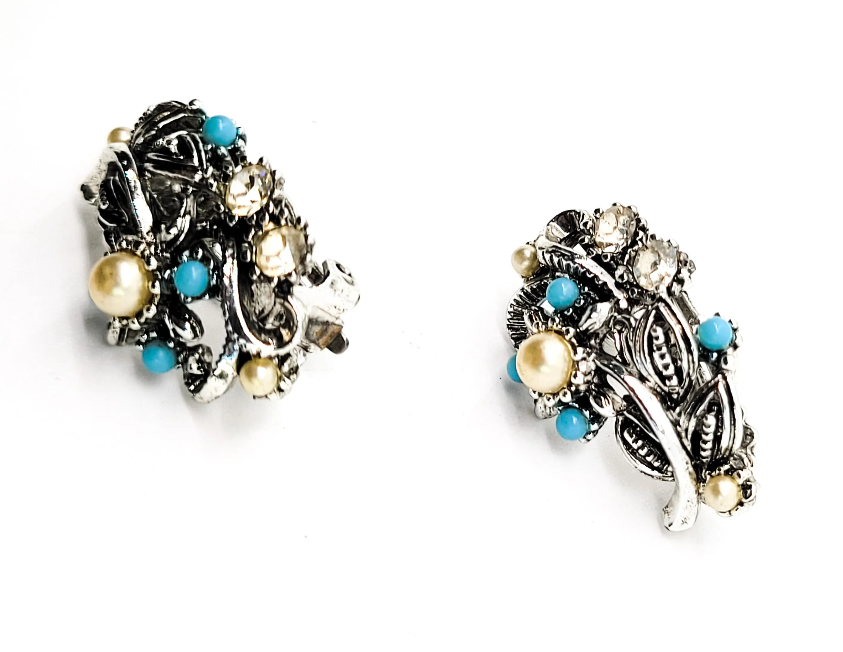 Star signed baby blue silver toned vintage flower earrings with faux pearl accents.
